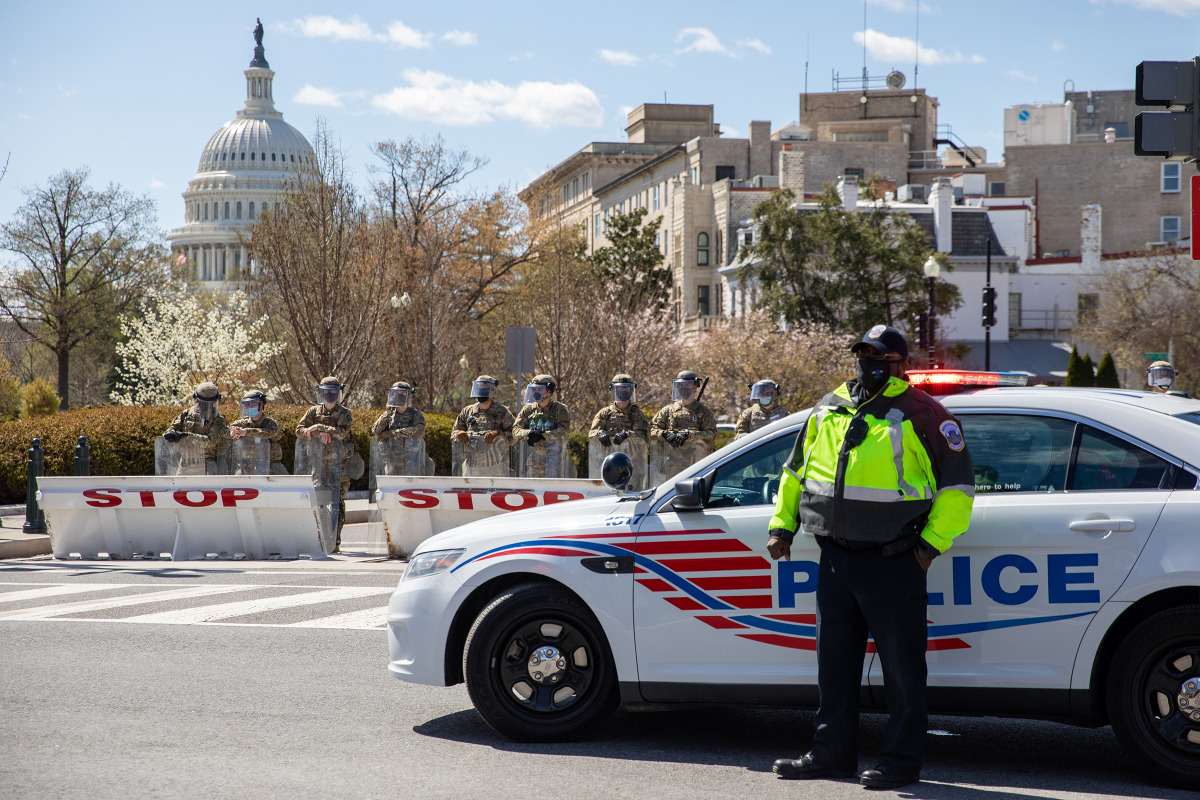 Members of the National Guard and police block off Constitution Avenue near the U.S. Capitol in Washington, D.C., where two Capitol police officers were struck by a vehicle that rammed into a barricade on Friday. Photo for The Washington Post by Amanda An