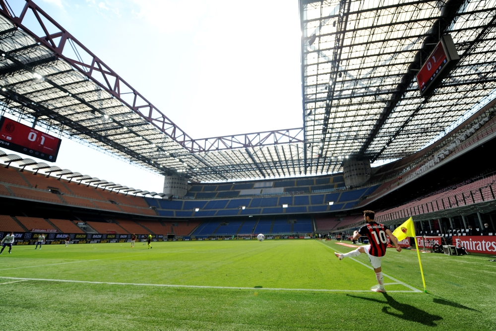AC Milan's Hakan Calhanoglu takes a corner REUTERS/Daniele Mascolo