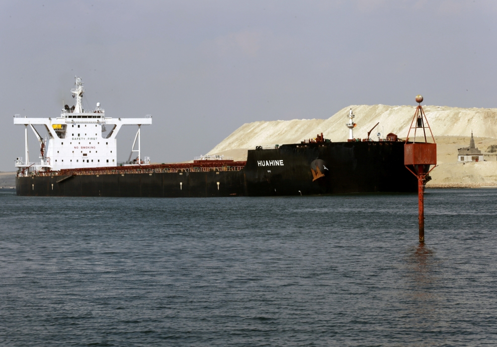 A ship is seen after sailing through Suez Canal as traffic resumes after a container ship that blocked the waterway was refloated, in Ismailia, Egypt, March 30, 2021. REUTERS/Hanaa Habib