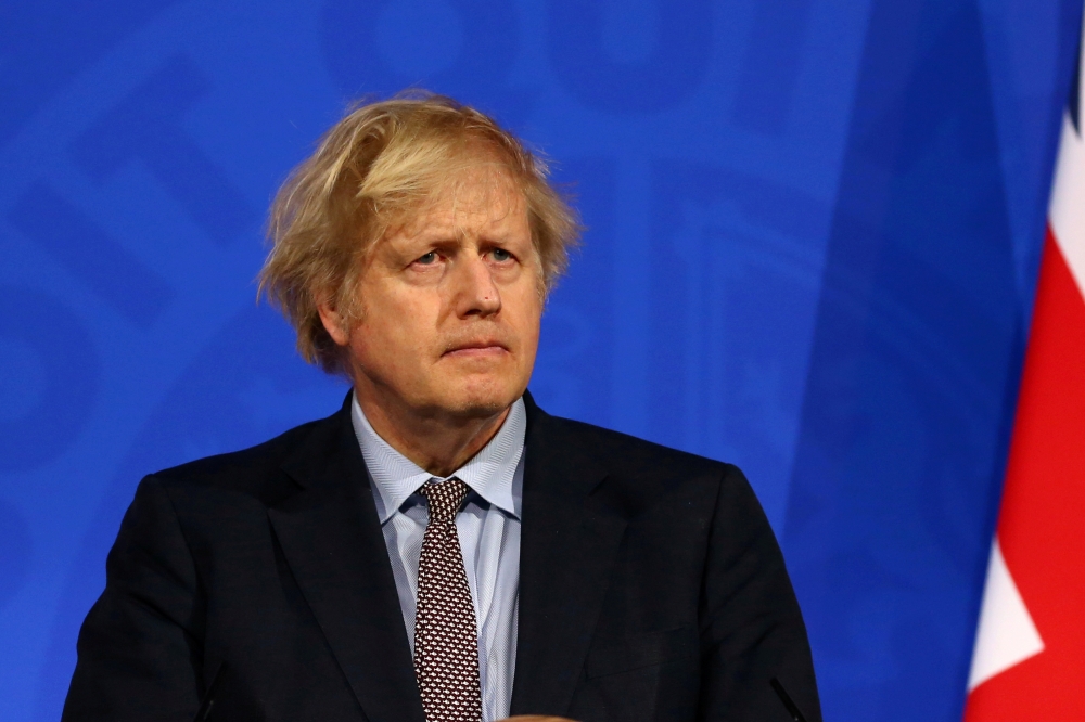 Britain's Prime Minister Boris Johnson holds a news conference on the coronavirus disease (COVID-19) pandemic, in London, Britain March 29, 2021. Hollie Adams/Pool via REUTERS/File Photo