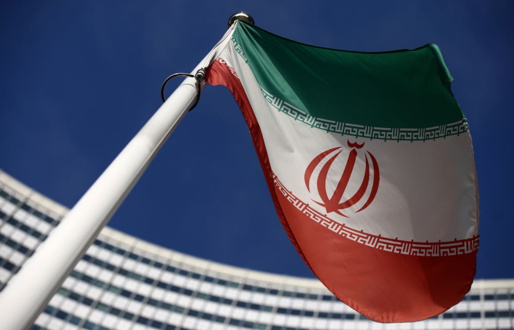 The Iranian flag waves in front of the International Atomic Energy Agency (IAEA) headquarters, before the beginning of a board of governors meeting, amid the coronavirus disease (COVID-19) outbreak in Vienna, Austria, March 1, 2021. Reuters/Lisi Niesner/F