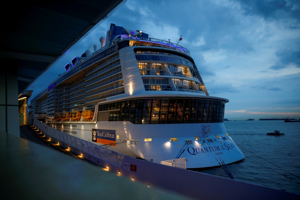 File photo: Royal Caribbean's Quantum of the Seas cruise ship is moored at Marina Bay Cruise Center after a passenger tested positive for coronavirus disease during a cruise to nowhere, in Singapore, December 9, 2020. Reuters/Edgar Su/File Photo