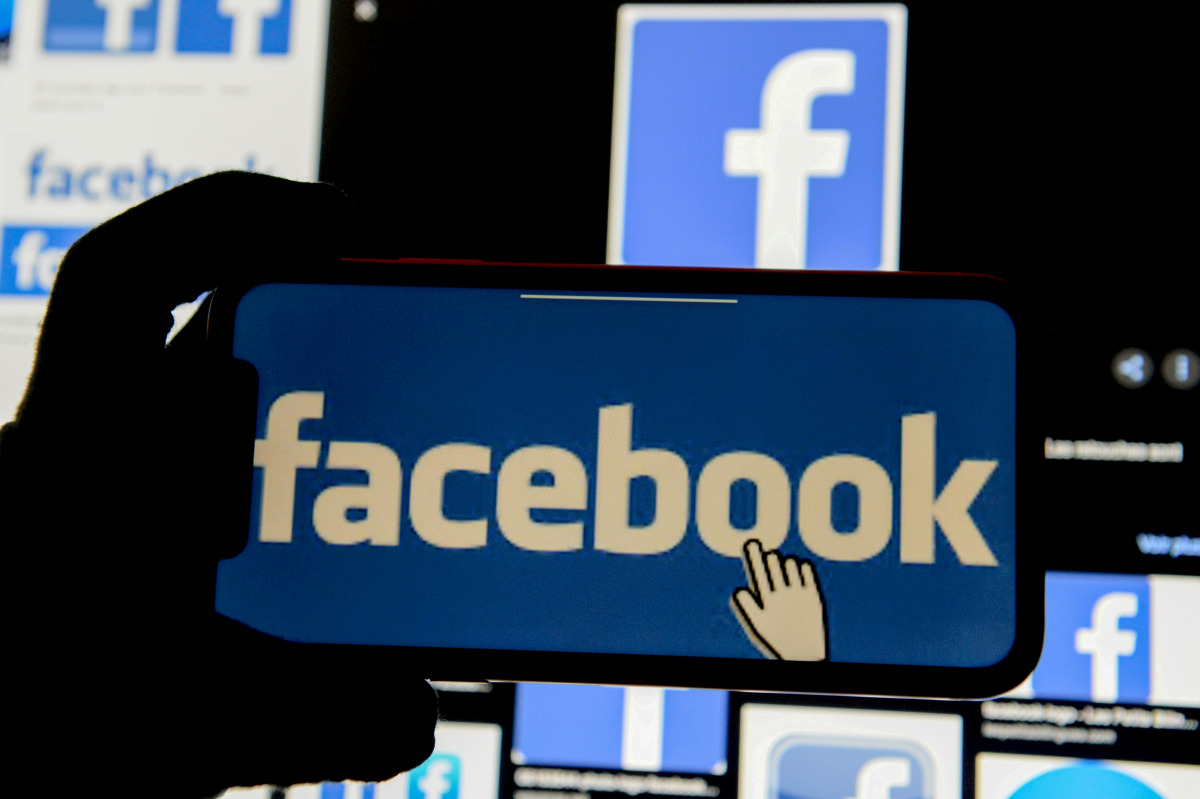 FILE PHOTO: The Facebook logo is displayed on a mobile phone in this picture illustration taken December 2, 2019. REUTERS/Johanna Geron/Illustration//File Photo
