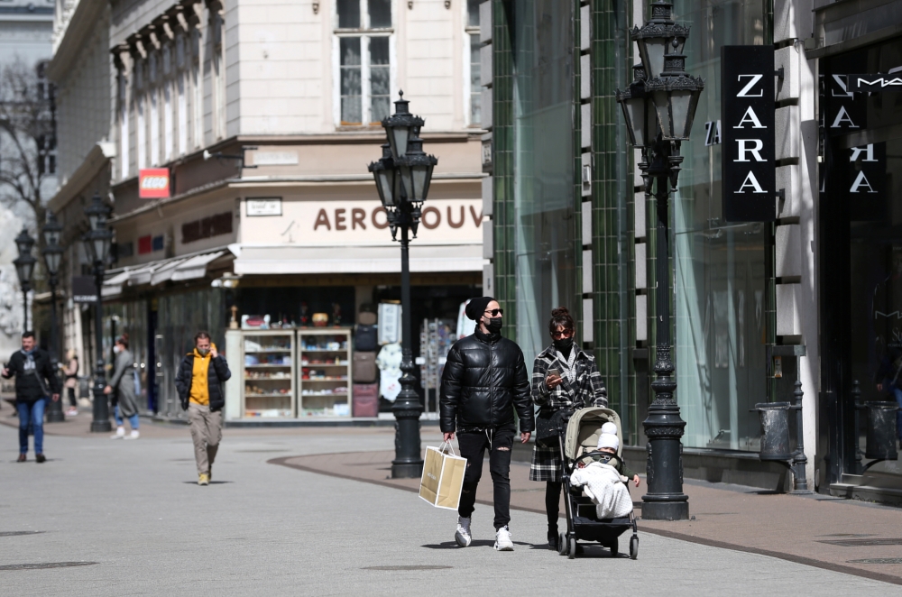 People walks in a shopping street as the shops reopen amid the coronavirus disease (COVID-19) pandemic in downtown Budapest, Hungary, April 7, 2021. REUTERS/Bernadett Szabo
