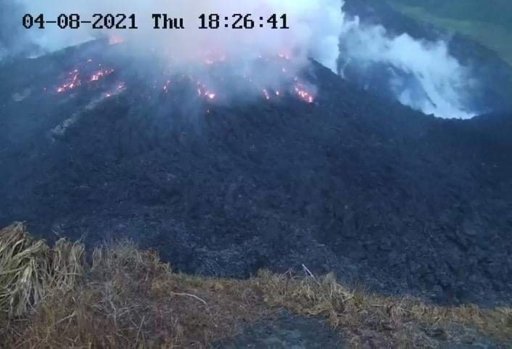 Smoke spews from the glowing dome of the La Soufriere volcano in Saint Vincent and the Grenadines, April 8, 2021, in this image obtained from the University of West Indies Seismic Research Center. Courtesy of The UWI Seismic Research Centre/ via REUTERS.