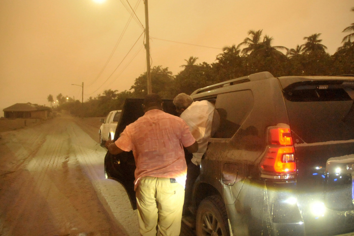 Prime Minister Ralph Gonsalves visits an ash covered village a day after the La Soufriere volcano erupted after decades of inactivity, about 2 miles (3.2 km) away in Rabaka, St Vincent and the Grenadines April 10, 2021. REUTERS/Robertson S. Henry
