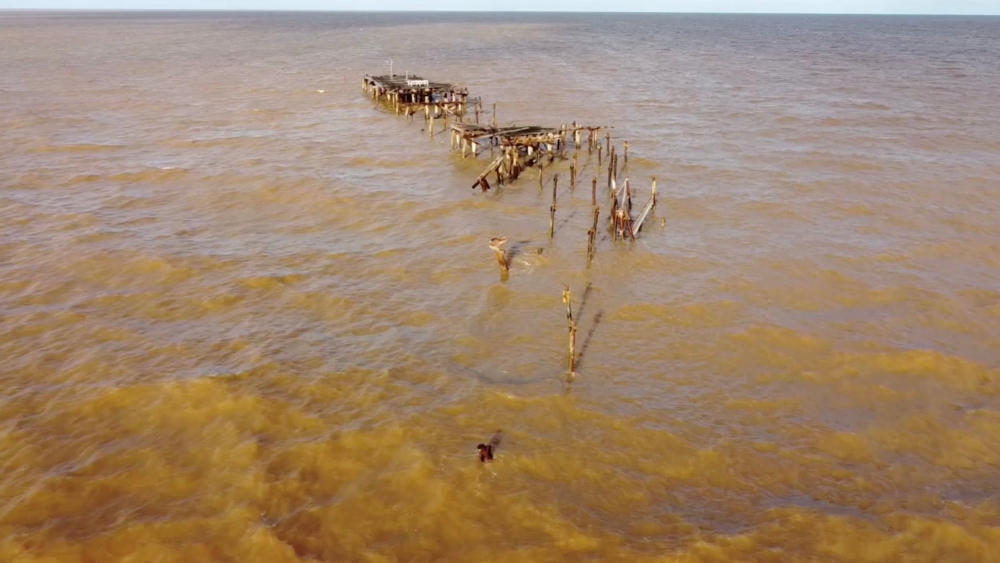One Mile Jetty is seen destroyed by tropical cyclone Seroja in Carnarvon, Australia April 11, 2021, in this still image taken from drone video footage obtained from social media by Reuters on April 12, 2021. Courtesy of Bill Kent/via REUTERS

