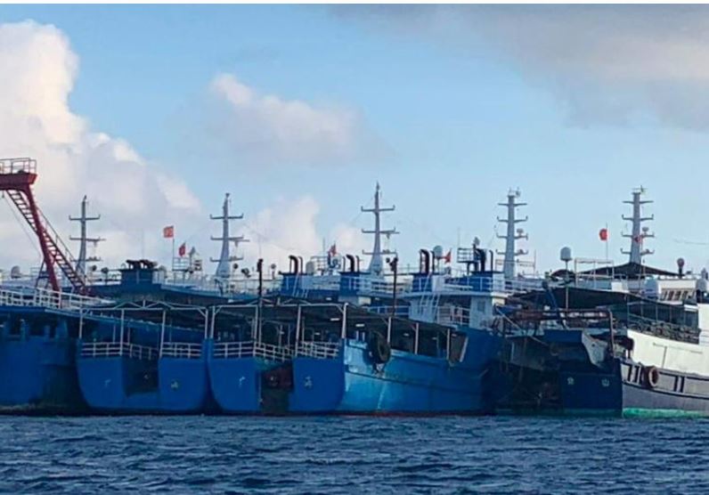 File photo: Chinese vessels, believed to be manned by Chinese maritime militia personnel, are seen at Whitsun Reef, South China Sea on March 27, 2021. Philippine Coast Guard/National Task Force-West Philippine Sea/Handout via Reuters