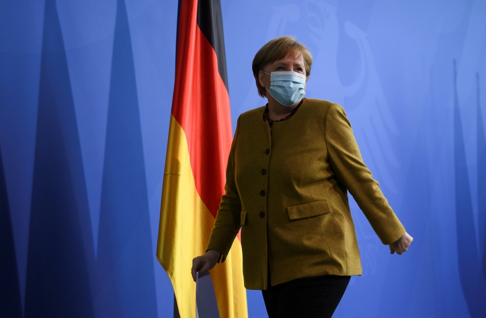 German Chancellor Angela Merkel leaves after giving a statement, amid the coronavirus disease (COVID-19) outbreak, in Berlin, Germany, April 13, 2021. REUTERS/Annegret Hilse/Pool