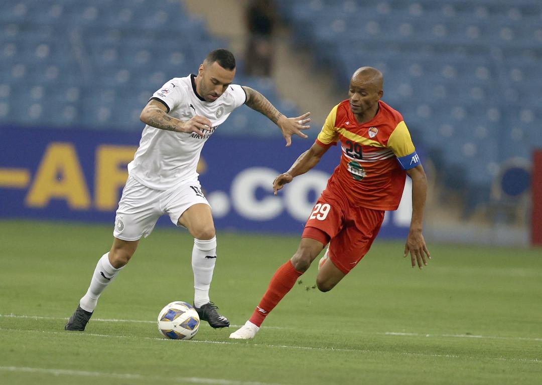 Al Sadd's Guilherme vies for the ball possession against a Foolad player during their opening Group C match yesterday. PIC: AL SADD