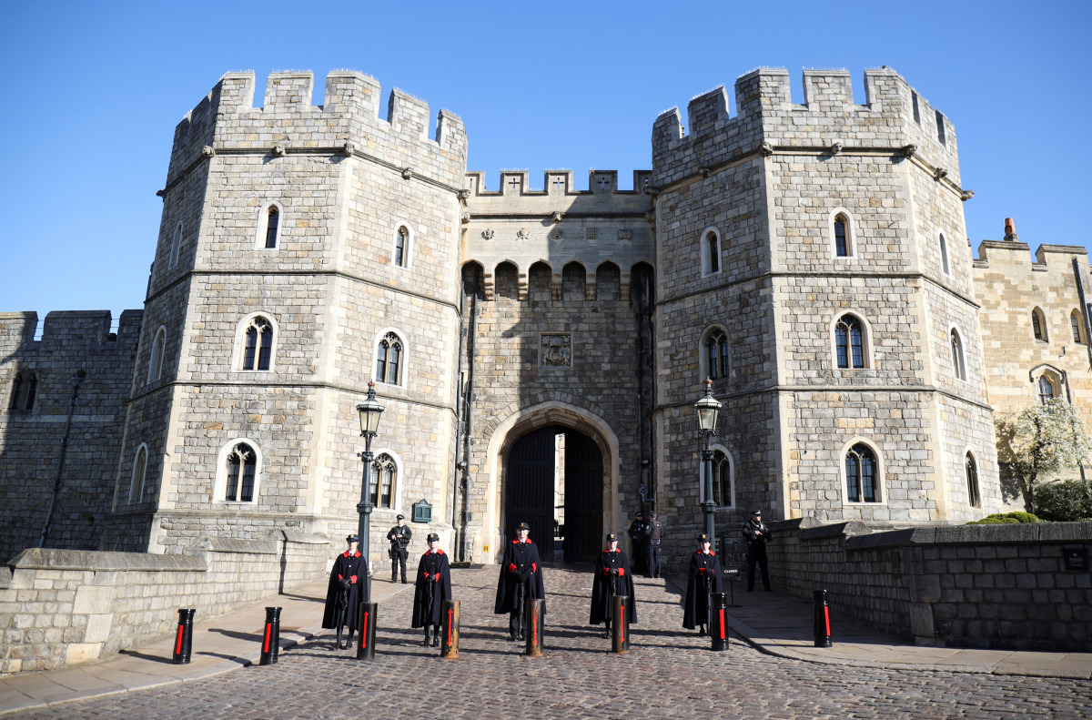 Wardens stand outside Windsor castle, after Britain's Prince Philip, husband of Queen Elizabeth, died at the age of 99, in Windsor, near London, Britain, April 15, 2021. REUTERS/Molly Darlington
