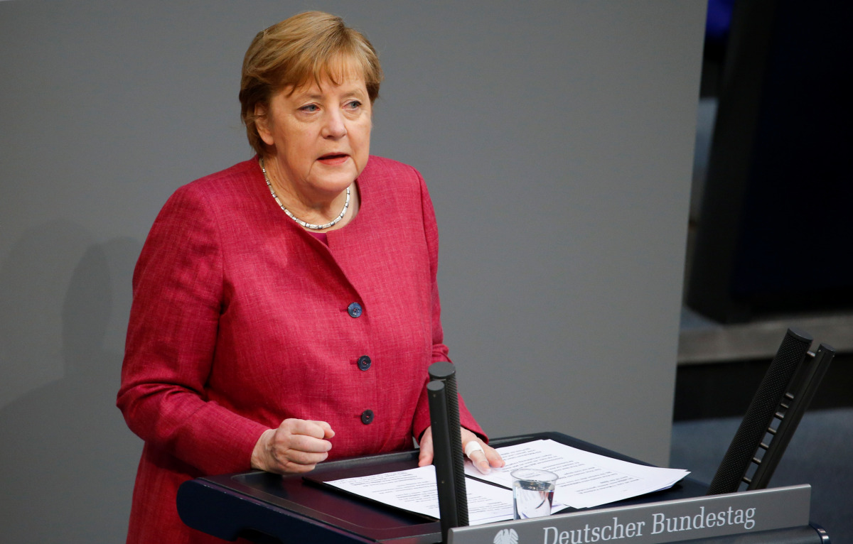 German Chancellor Angela Merkel speaks during a session of the lower house of parliament Bundestag debating the coronavirus disease (COVID-19) measures, in Berlin, Germany, April 16, 2021. REUTERS/Michele Tantussi
