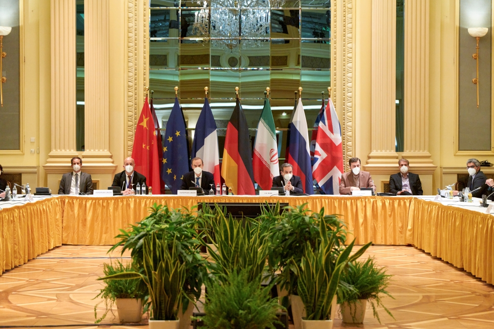 European External Action Service (EEAS) Deputy Secretary General Enrique Mora and Iranian Deputy at Ministry of Foreign Affairs Abbas Araghchi wait for the start of a meeting of the JCPOA Joint Commission in Vienna, Austria on April 17, 2021. (EU Delegati