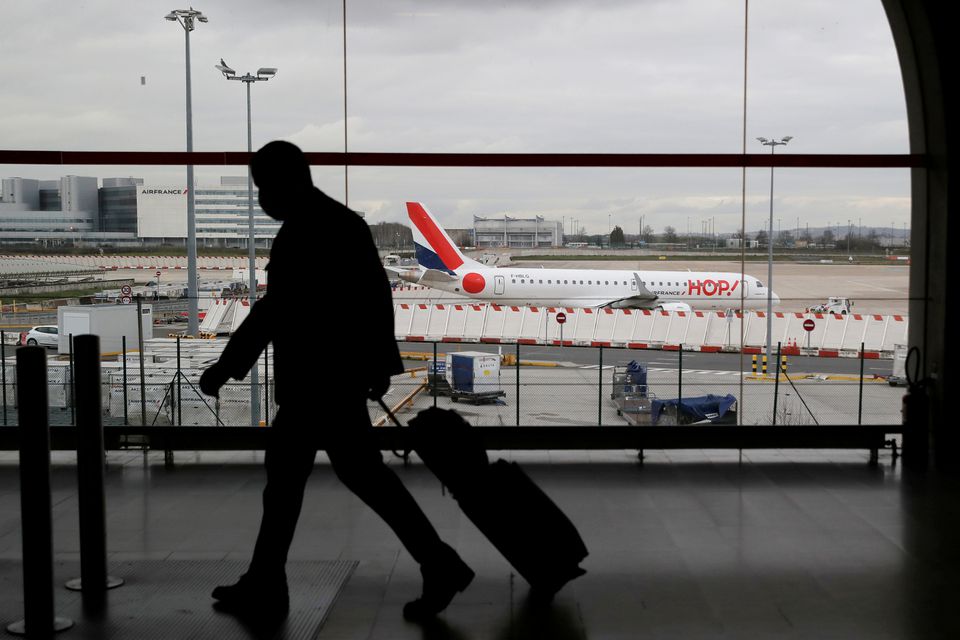 A man walks inside a Terminal at Paris Charles de Gaulle airport in Roissy near Paris as France closed its borders to travellers outside European Union due to restrictions against the spread of the coronavirus disease (COVID-19) in France, February 5, 202