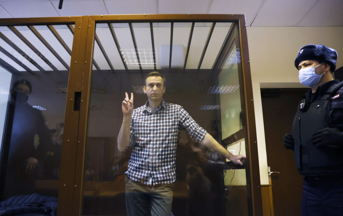 FILE PHOTO: Russian opposition leader Alexei Navalny attends a hearing to consider an appeal against an earlier court decision to change his suspended sentence to a real prison term, in Moscow, Russia February 20, 2021. REUTERS/Maxim Shemetov/File Photo
