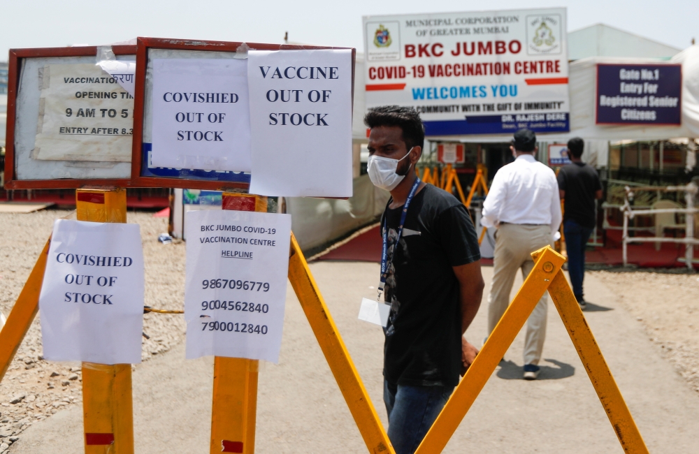 Notices about the shortage of COVISHIELD, a coronavirus disease (COVID-19) vaccine manufactured by Serum Institute of India, are seen outside a COVID-19 vaccination centre in Mumbai, India, April 20, 2021. REUTERS/Francis Mascarenhas