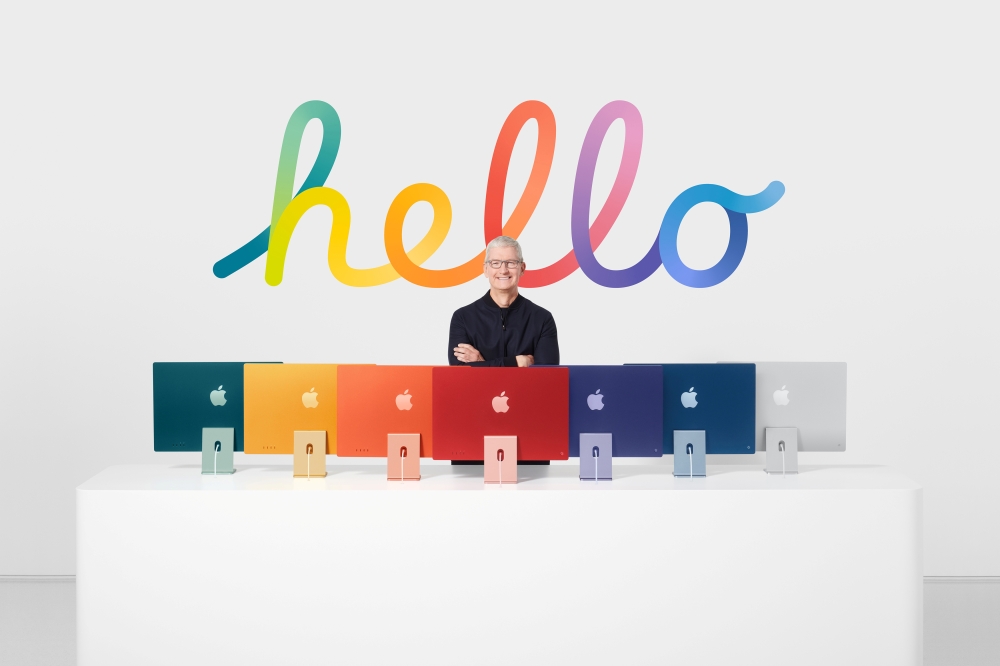 Apple CEO Tim Cook stands with the all-new iMac lineup, in this still image from the keynote video of a special event at Apple Park in Cupertino, California, U.S. released April 20, 2021. Apple Inc./Handout via REUTERS