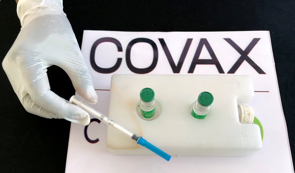 A nurse prepares to administer the AstraZeneca/Oxford vaccine under the COVAX scheme against the coronavirus disease (COVID-19) at the Eka Kotebe General Hospital in Addis Ababa, Ethiopia March 13, 2021. REUTERS/Tiksa Negeri/File Photo