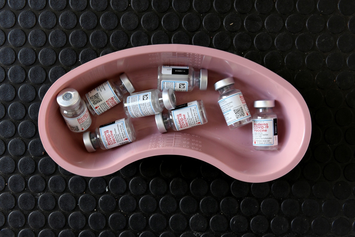 Empty vials of Moderna COVID-19 vaccine are pictured in a kidney dish at a rest stop near Drayton, North Dakota where Manitoba-based truckers, transporting goods to and from the United States, were vaccinated against coronavirus disease (COVID-19) as part
