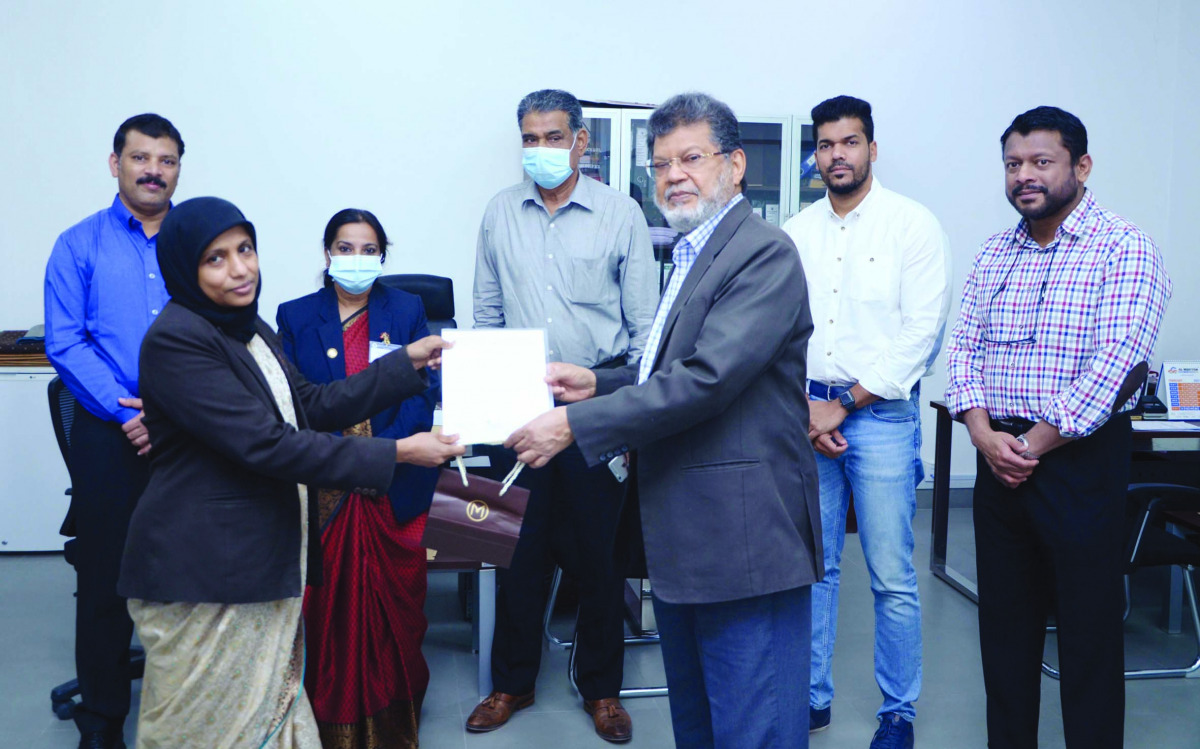 A member of the staff being honoured  during the ceremony. 