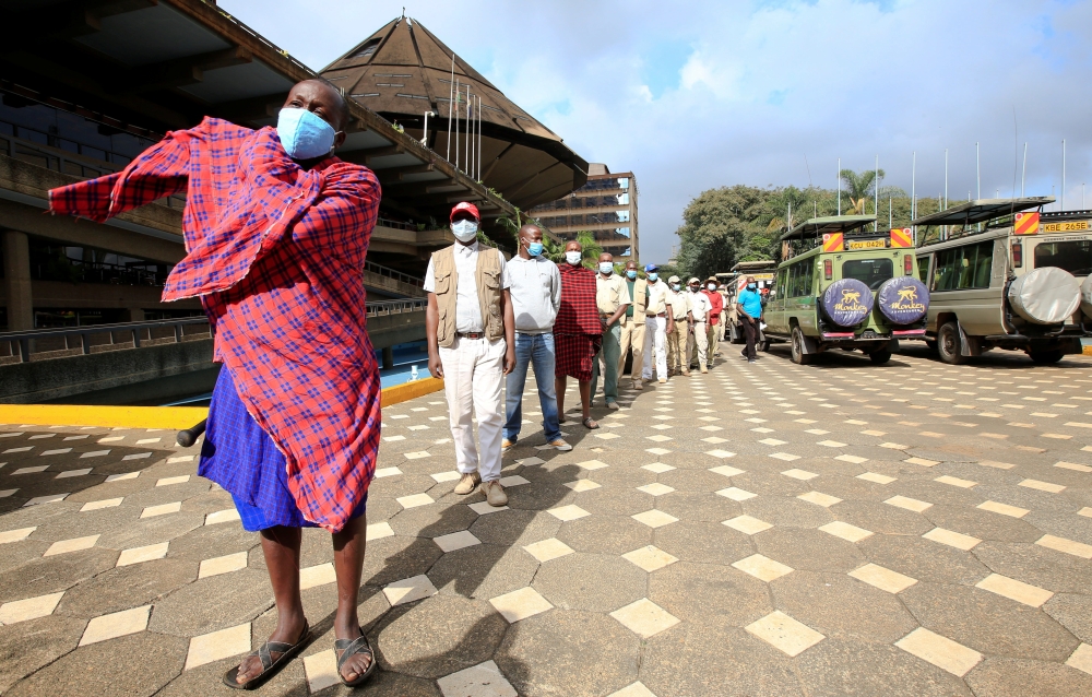 Kenyan tour guides and travel operators queue to receive the AstraZeneca/Oxford vaccine against the coronavirus disease (COVID-19), under the COVAX scheme, in Nairobi, Kenya, April 27, 2021. REUTERS/Monicah Mwangi