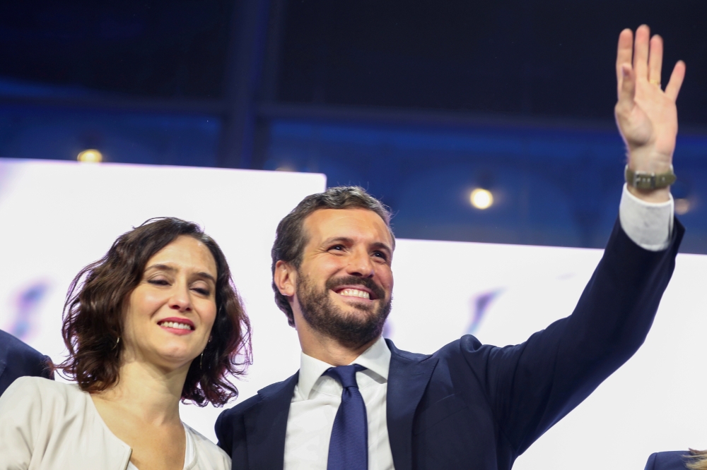 File photo: Isabel Diaz Ayuso, President of the Community of Madrid, stands next to Spain's People's Party (PP) leader Pablo Casado during a campaign closing rally ahead of general election, at Las Ventas bullring in Madrid, Spain November 8, 2019. Reuter