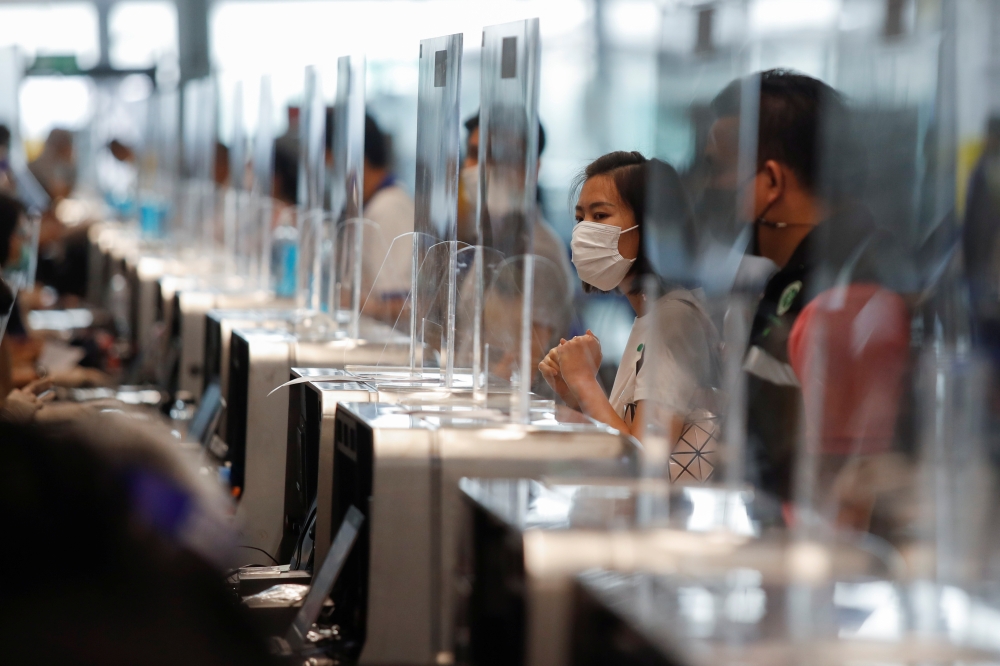 People line up to receive their vaccine against the coronavirus disease (COVID-19) at Suvarnabhumi airport in Bangkok, Thailand April 28, 2021. REUTERS/Jorge Silva