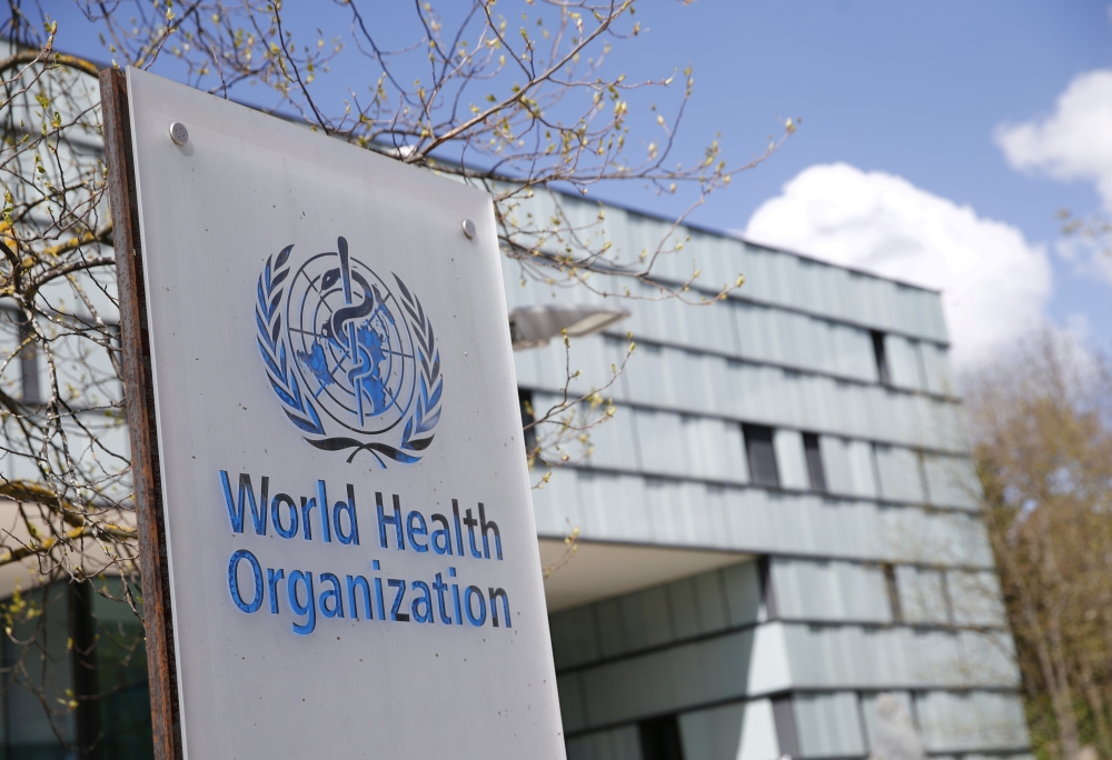 A logo is pictured outside a building of the World Health Organization (WHO) during an executive board meeting on update on the coronavirus disease (COVID-19) outbreak, in Geneva, Switzerland, April 6, 2021. REUTERS/Denis Balibouse/File Photo