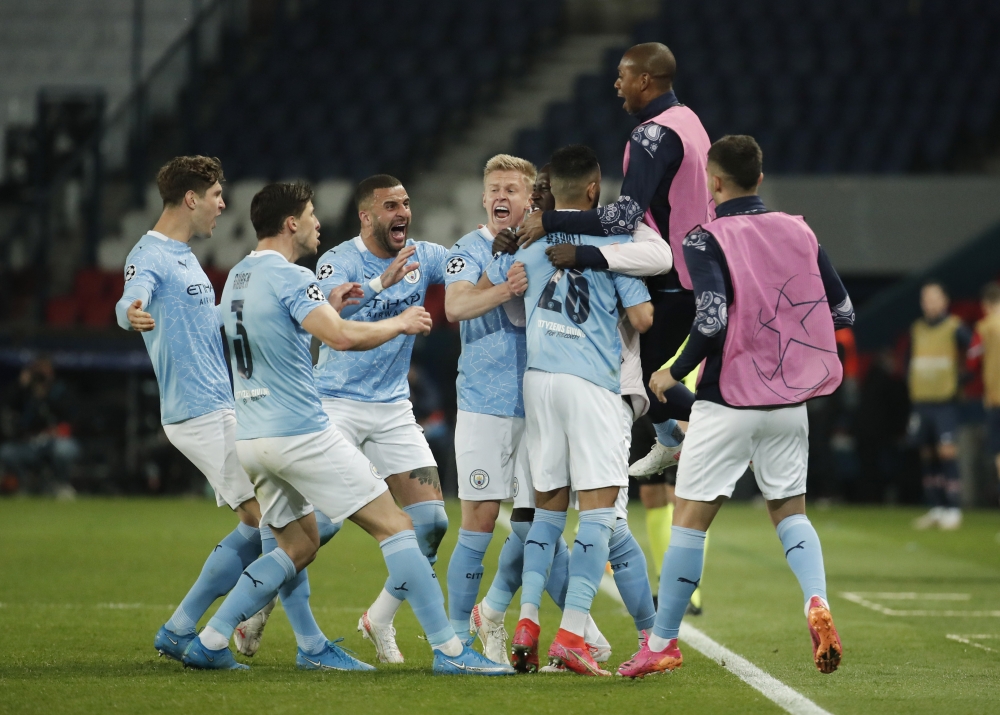 Manchester City's Riyad Mahrez celebrates scoring their second goal with teammates REUTERS/Benoit Tessier