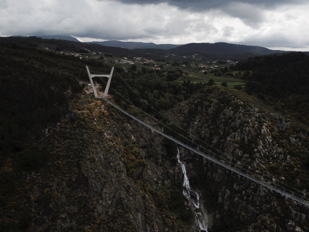 A general view of the world's longest pedestrian suspension bridge '516 Arouca', now open for local residents in Arouca, Portugal, April 29, 2021. Picture taken with a drone. REUTERS/Julio Torres