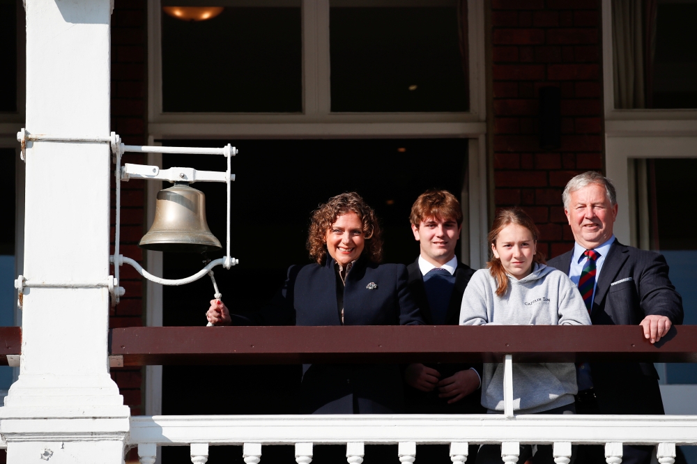 The family of Captain Sir Tom Moore, Hannah Ingram-Moore, Benjie Ingram-Moore, Georgia Ingram-Moore, and Colin Ingram-Moore, ring the bell at Lord's cricket ground, in London, Britain, April 30, 2021.