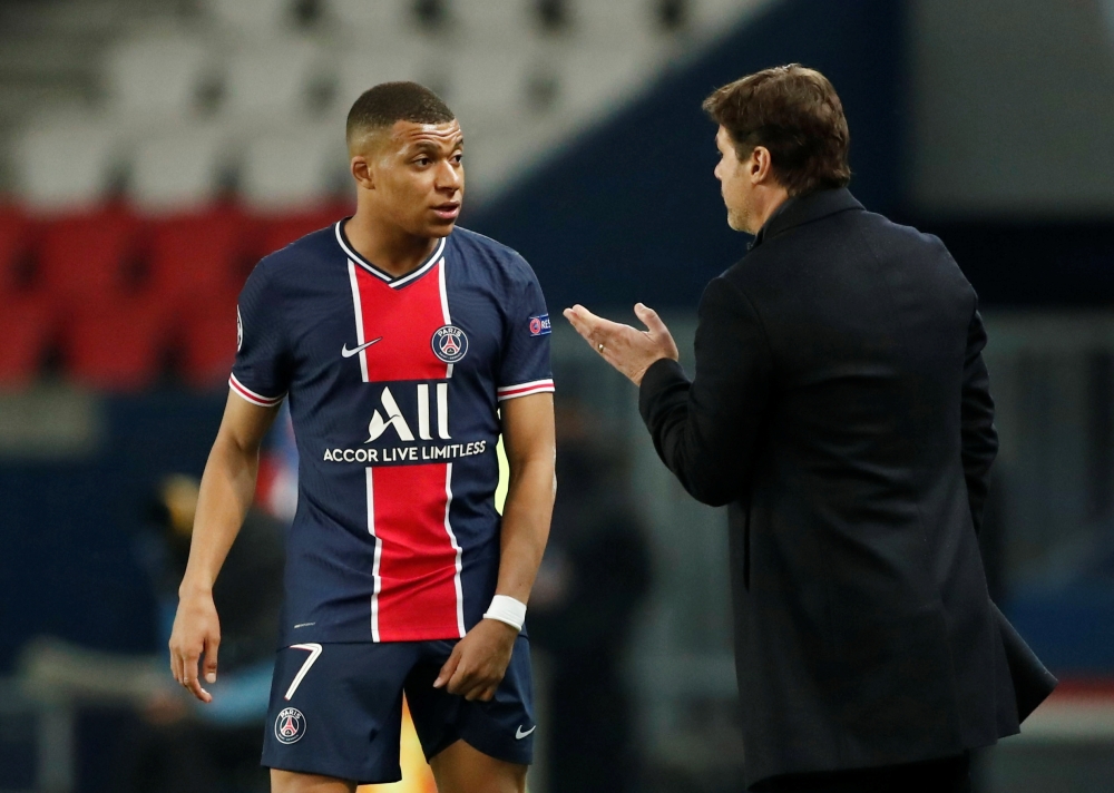April 28, 2021 Paris St Germain's Kylian Mbappe with coach Mauricio Pochettino REUTERS/Benoit Tessier/File Photo