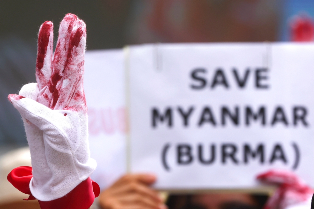 A protester flashes a three-finger salute during a march to protest against Myanmar military coup, in Taipei, Taiwan, May 2, 2021. Reuters/Ann Wang