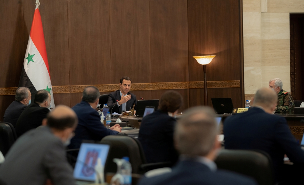 FILE PHOTO: Syrian President Bashar al-Assad speaks at a cabinet meeting in Damascus, Syria, in this handout picture released by Sana on March 30, 2021. SANA/Handout via REUTERS/File Photo