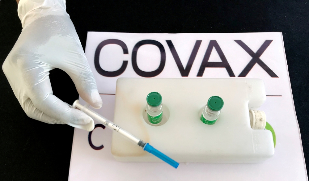 A nurse prepares to administer the AstraZeneca/Oxford vaccine under the COVAX scheme against the coronavirus disease (COVID-19) at the Eka Kotebe General Hospital in Addis Ababa, Ethiopia March 13, 2021. Reuters/Tiksa Negeri/File Photo