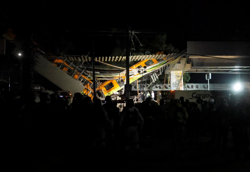 The site where an overpass for a metro partially collapsed with train cars on it is seen at Olivos station in Mexico City, Mexico May 4, 2021. REUTERS/Carlos Jasso