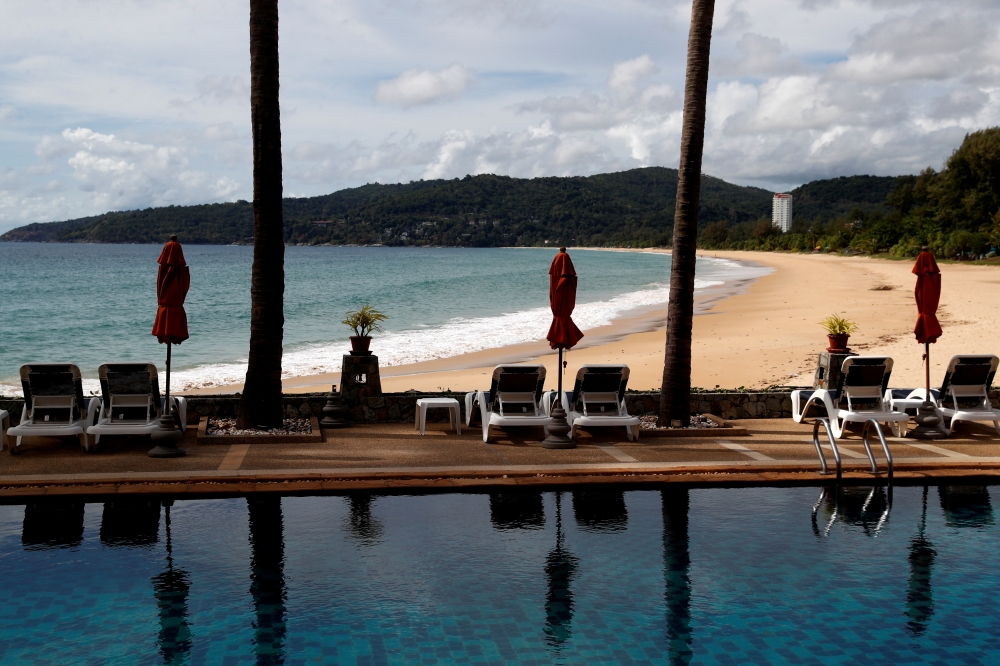 An empty hotel and beach which have opened for visitors is seen in Karon, Phuket Island, Thailand March 31, 2021. Picture taken March 31, 2021. REUTERS/Jorge Silva/File Photo