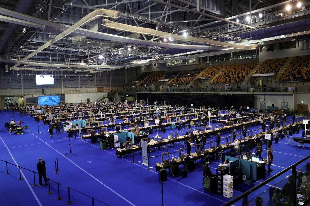 Election staff members count votes for the Scottish Parliamentary election at a counting centre in Glasgow, Scotland, Britain, May 7, 2021. REUTERS/Russell Cheyne