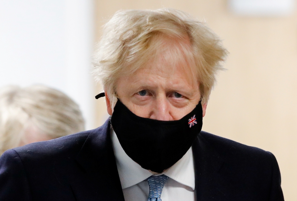Britain's Prime Minister Boris Johnson wears a mask during a visit to Severn Trent Academy in Coventry, West Midlands, Britain, May 7, 2021. (Reuters/Phil Noble/Pool)