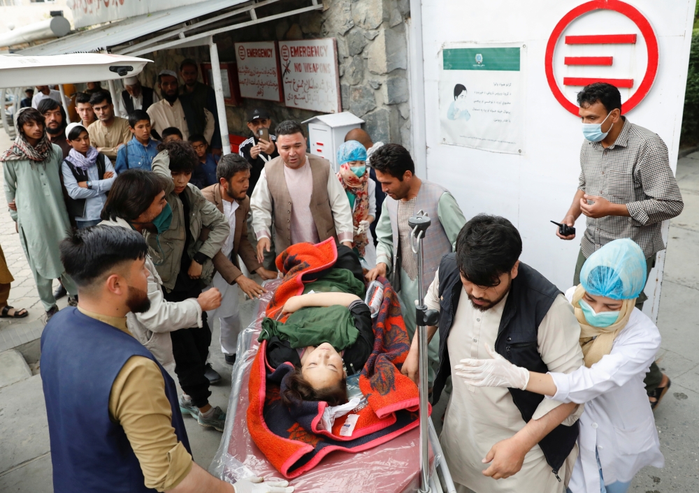 An injured woman is transported to a hospital after a blast in Kabul, Afghanistan May 8, 2021. (Reuters/Mohammad Ismail)