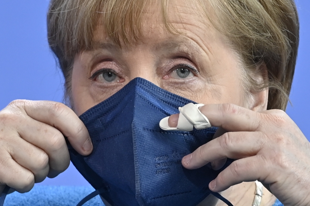 German Chancellor Angela Merkel wears a protective mask after a news conference in Berlin, Germany May 8, 2021. John MacDougall/Pool via REUTERS