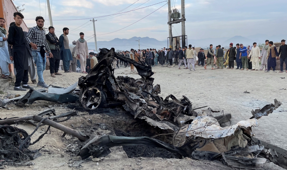 People stand at the site of a blast in Kabul, Afghanistan May 8, 2021. Reuters/Stringer