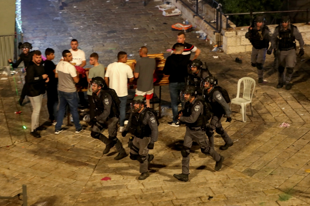 Israeli police are deployed during clashes with Palestinians at Damascus Gate on Laylat al-Qadr during the holy month of Ramadan, in Jerusalem's Old City, May 8, 2021. REUTERS/Ronen Zvulun