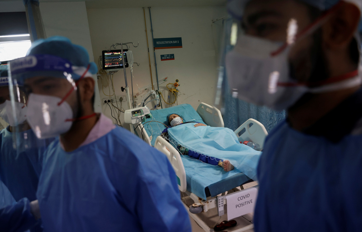 Geetika, 45, who is suffering from coronavirus disease (COVID-19), receives treatment as a Syringe Infusion Pump, donated by France is seen next to her bed, inside the emergency room of Safdarjung Hospital in New Delhi, India, May 7, 2021. REUTERS/Adnan A