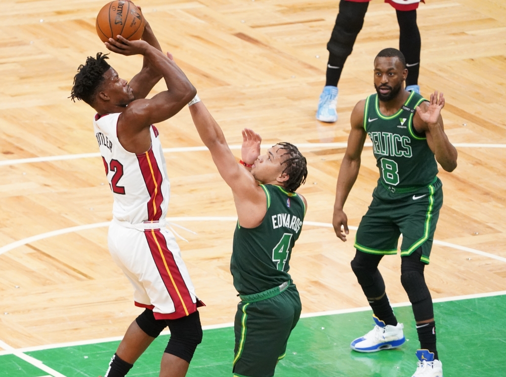 Miami Heat forward Jimmy Butler (22) scores against Boston Celtics guard Carsen Edwards (4) in the first quarter at TD Garden. David Butler