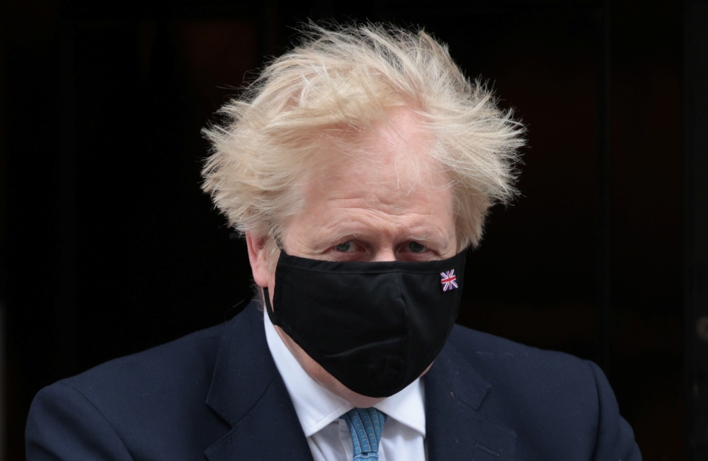 Britain's Prime Minister Boris Johnson walks outside Downing Street in London, Britain, May 12, 2021. (Reuters/Hannah McKay)