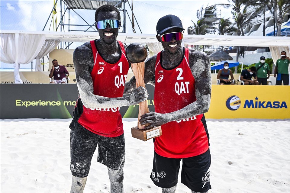 Cherif Younousse  (left) and Ahmed Tijan pose with the Cancun trophy. 