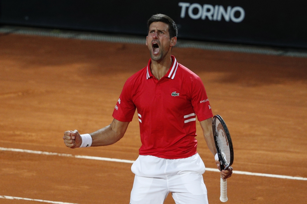 Serbia's Novak Djokovic reacts during his semi final match against Italy's Lorenzo Sonego REUTERS/Guglielmo Mangiapane