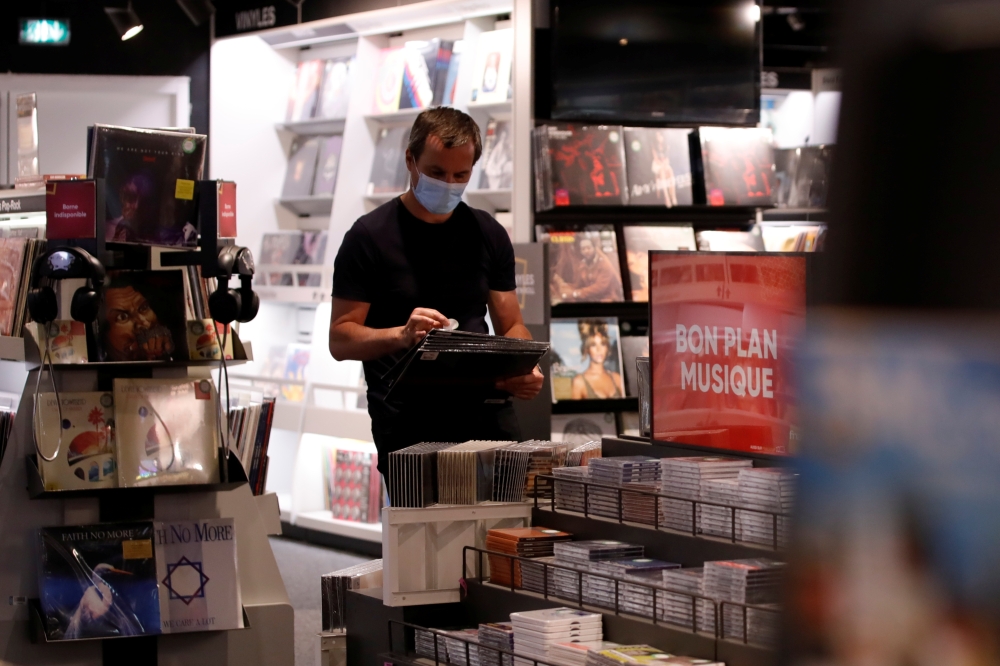 A staff member works during preparations for the reopening of a Fnac store in Paris as part of an easing of the country's lockdown restrictions amid the coronavirus disease (COVID-19) outbreak in France, May 18, 2021. REUTERS/Sarah Meyssonnier