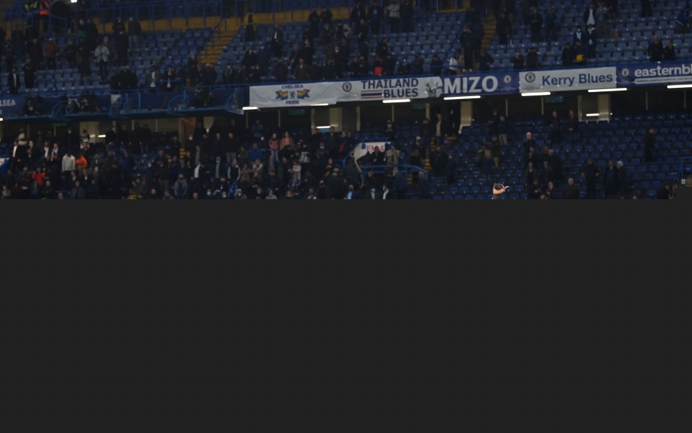 Chelsea players applaud fans during a lap of appreciation after the match, as a limited number of fans are permitted at outdoor sports venues Pool via REUTERS/Glyn Kirk
